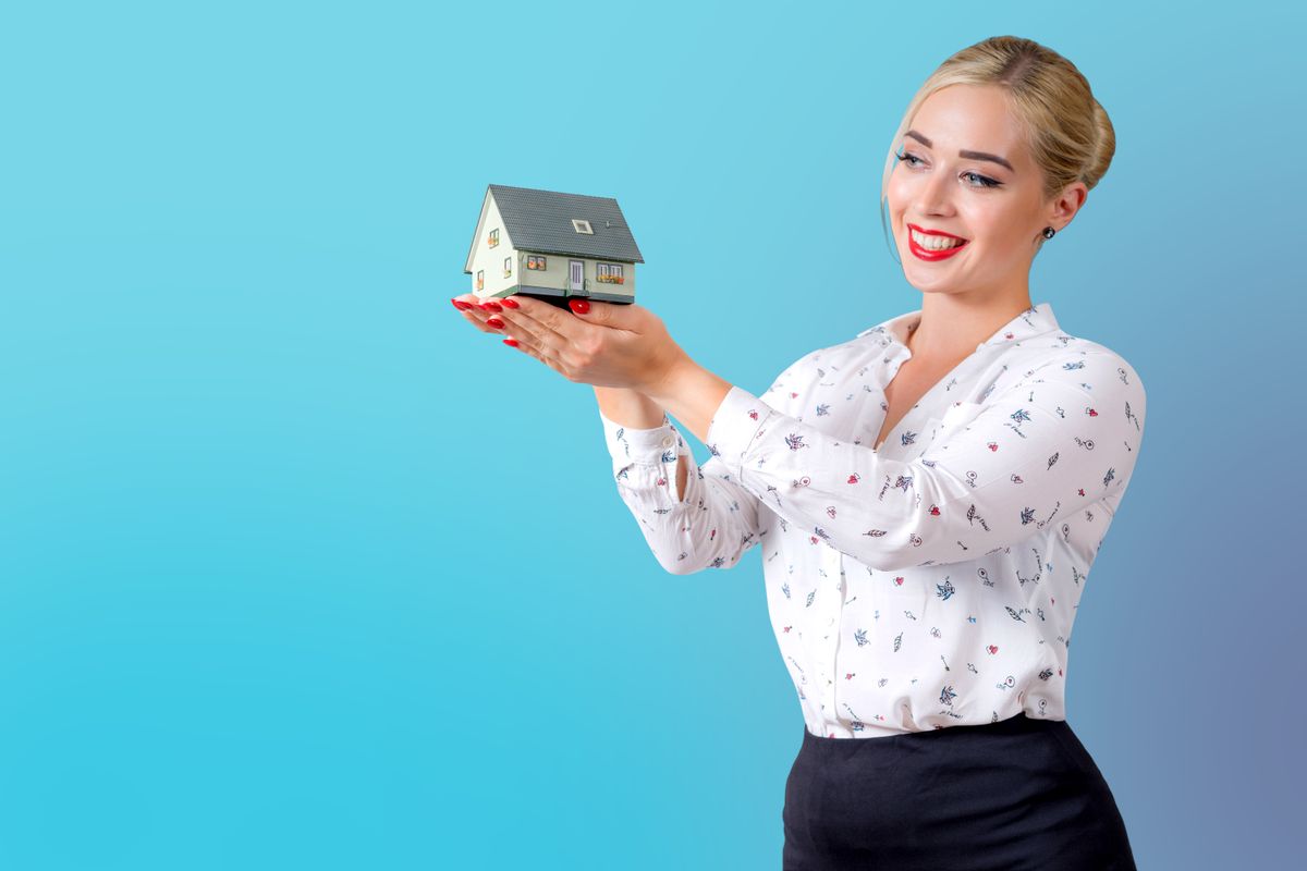 A property manager handing over keys to a new tenant